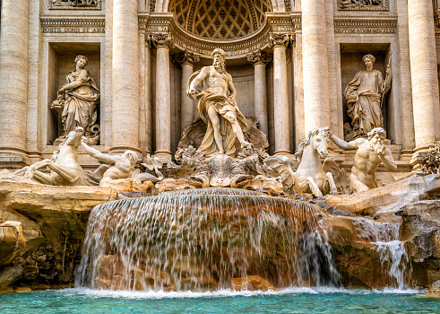 Trevi Fountain in Rome, Italy, Europe. Old Trevi Fountain is famous landmark of Rome. Italian Baroque architecture, nice historical building with beautiful sculpture and statues in Roma city center.