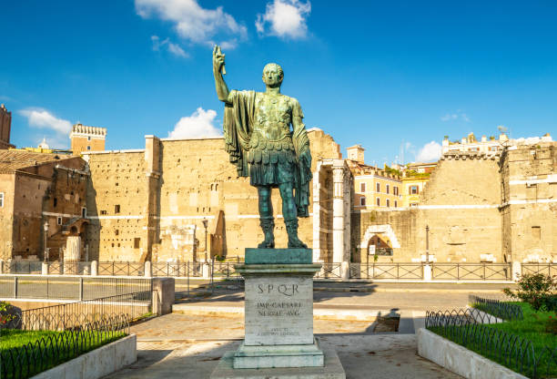 Bronze statue of emperor Nerva, Rome, Italy Bronze statue of emperor Nerva, Rome, Italy. Ancient Roman monument at Imperial Forum ruins in Rome city center. This place is tourist attraction of Rome. Travel, sightseeing and history concept. bronze statue stock pictures, royalty-free photos & images