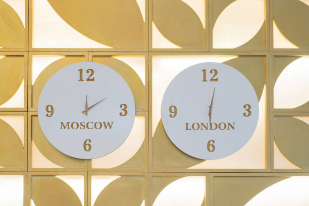 istock Hanging wall clocks showing the time zone of different countries. 1390537651