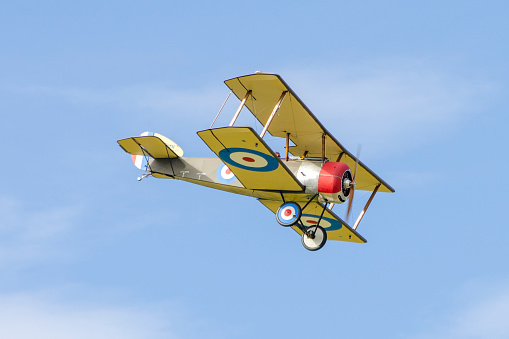 Replica Sopwith Pup WW1 biplane in British military colors.