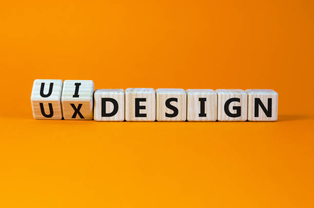 istock UX user experience design or UI user interface design symbol. Turned wooden cubes and changed words UX design to UI design. Beautiful orange background. Business UX or UI design concept. Copy space. 1390539539