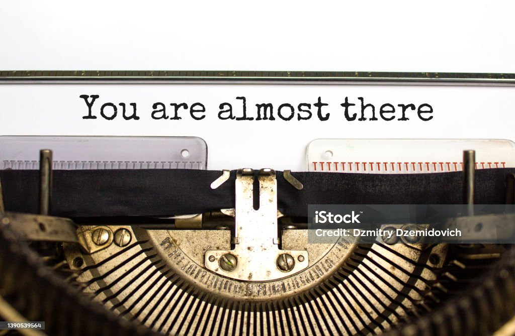 You are almost there symbol. Concept words You are almost there typed on retro typewriter. Beautiful white background. Business and you are almost there concept. Copy space. Finishing Stock Photo