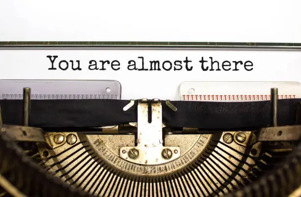 Photo of You are almost there symbol. Concept words You are almost there typed on retro typewriter. Beautiful white background. Business and you are almost there concept. Copy space.