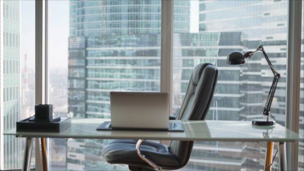 istock Office with panoramic windows over city landscape. Wardrobe against the background of panoramic windows in a skyscraper 1390540802