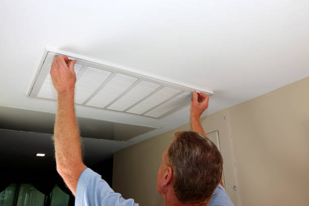 istock Adult Fingers Placed on White Air Intake Vent Grid Open Latches 1390549629