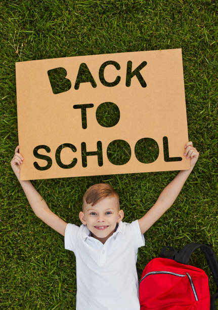 istock Happy boy with Back to School poster 1390551563