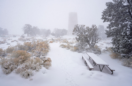 Pathway to the Desert View Watchtower during snow storm. South Rim, Grand Canyon National Park, Arizona, USA.