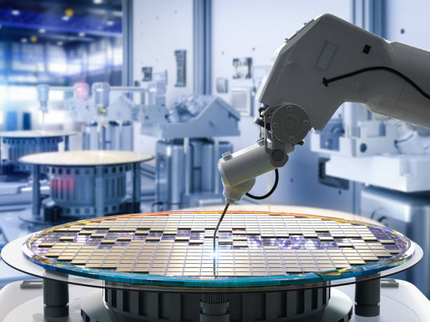 Semiconductor manufacturing with robotic arms stock photo