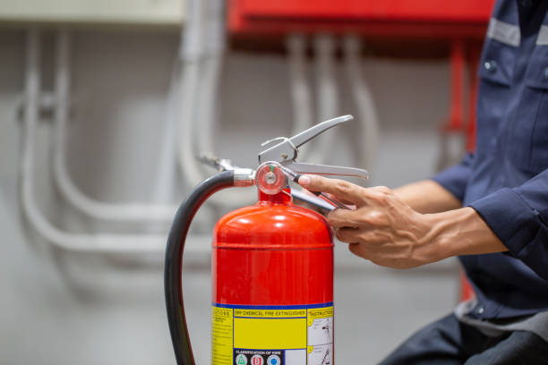 istock Engineer are checking and inspection a fire extinguishers tank in the fire control room for safety training and fire prevention. 1390554063