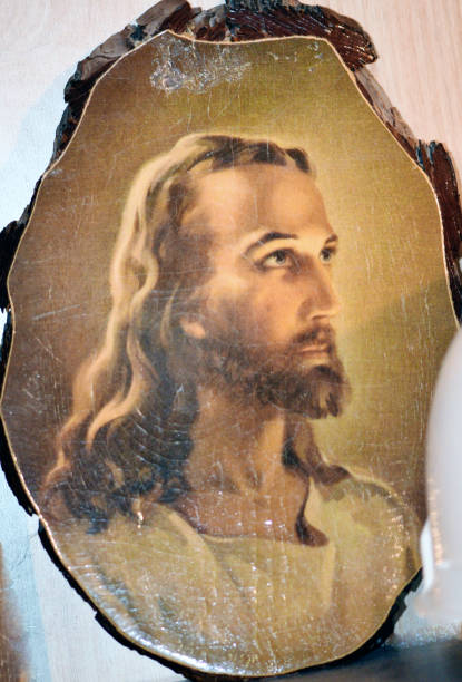 Antique picture of Jesus on chunk of wood.