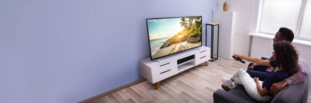 istock Affectionate Family Watching TV 1390560315