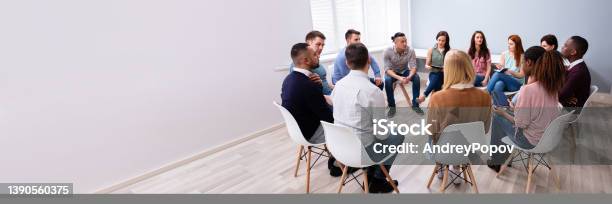 Multiethnic People Sitting In Circle Counseling Stock Photo - Download Image Now - Psychotherapy, Group Of People, Mental Health Professional