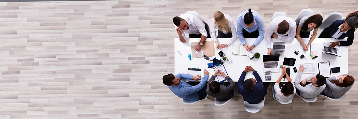 Overhead View Of A Multiracial Business People Sitting Together Having Discussion In The In Meeting