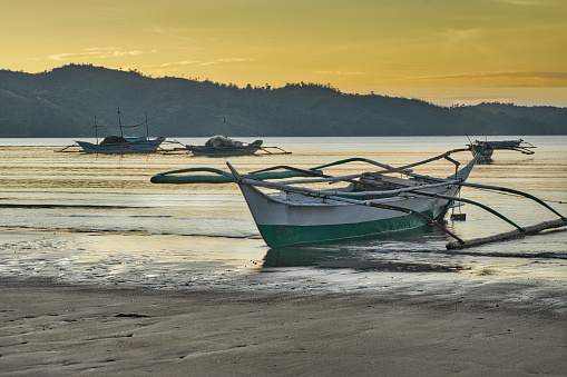 Dawn,  Traditional fishing boats, Bulalacao, Oriental Mindoro, The Philippines.
