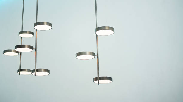 istock A silver metal lamp in cylinder shape hangs on the ceiling. 1390572886