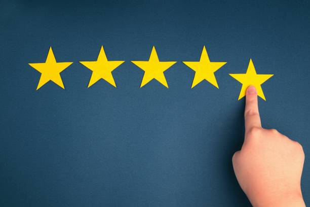 istock The customer's hand gives a five-star rating on a blue background. 1390582637