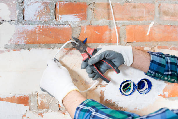 istock A construction electrician cuts a voltage cable during a repair close-up 1390583216