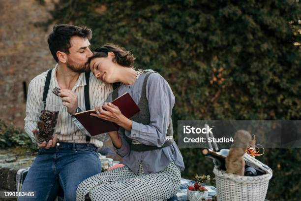 Newly Weds Having Their Time Vacation Stock Photo - Download Image Now - Couple - Relationship, Book, Chocolate