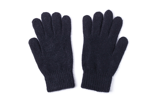 Black wool knitted gloves isolated on white