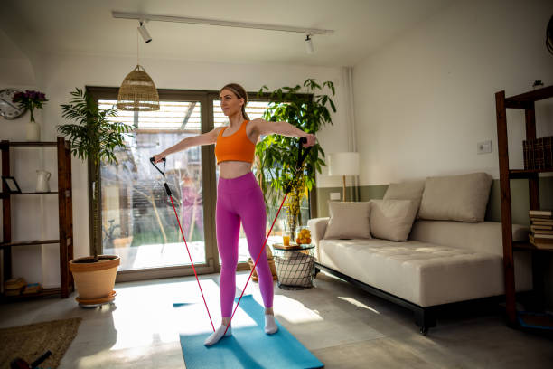 istock Woman exercising at home 1390589548