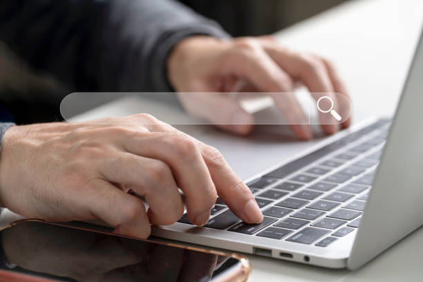istock Businessman use Computer laptop to Searching for information, Technology Search Engine Optimization on tablet internet networking, Search Console with your website 1390591287