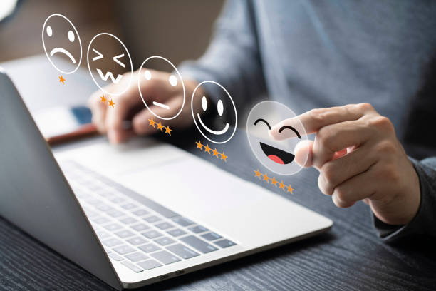 istock Businessman using computer laptop with popup rating icon for feedback review , Customer give rating to service experience on online application for giving best score 1390591353