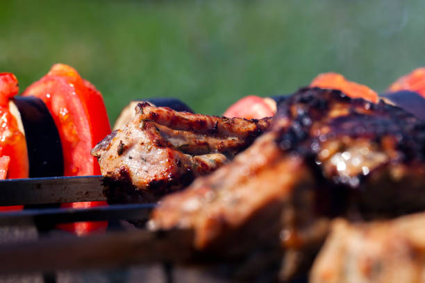 istock barbecue with cooking meat on the fire 1390594647
