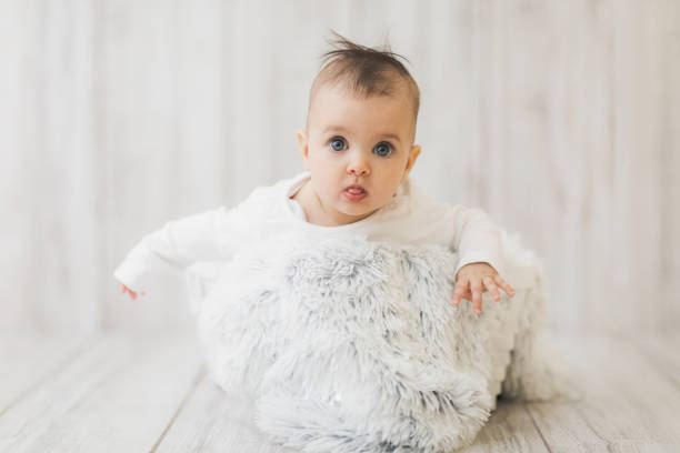 istock baby sitting in the white basket 1390596495
