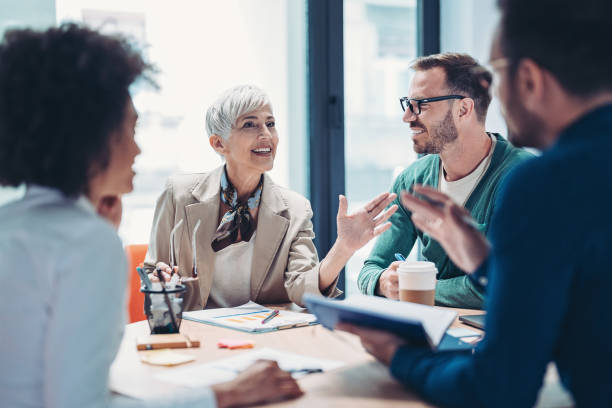 istock Senior manager talking to her team 1390599538