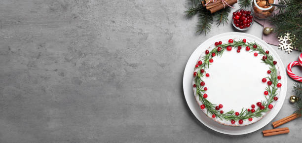 istock Flat lay composition with traditional Christmas cake on light grey table, space for text. Banner design 1390605861