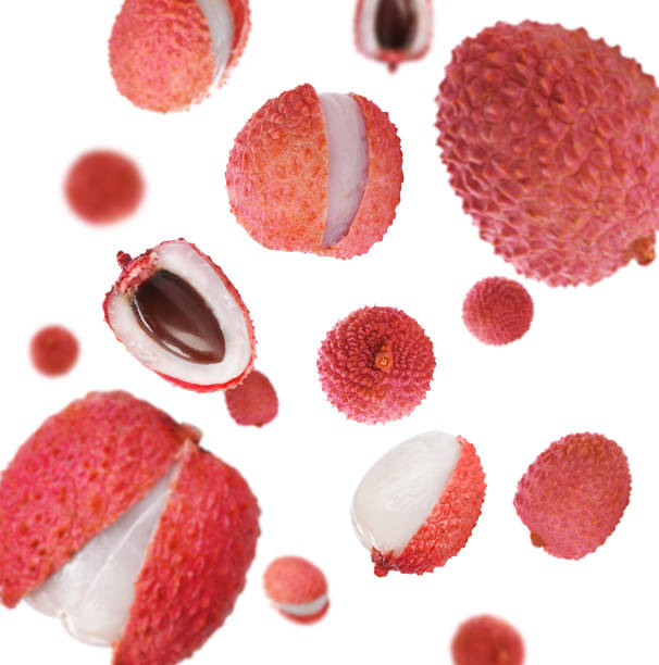 istock Set of falling delicious lychees on white background 1390606036