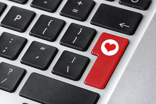 istock Love button on laptop keyboard, closeup. Online dating site 1390606346