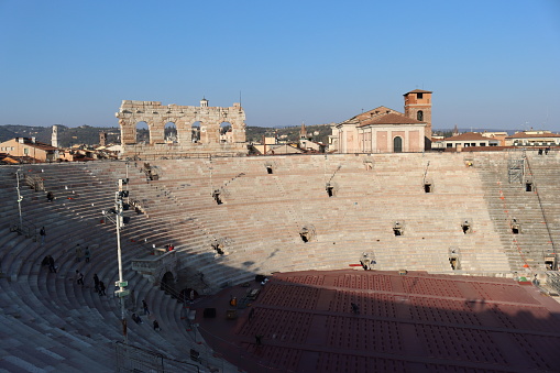 Verona, Italy- March 19, 2022: Inside Arena of Verona, ancient roman amphitheatre. Blue sky in the background. Detailed photography of the old architecture.