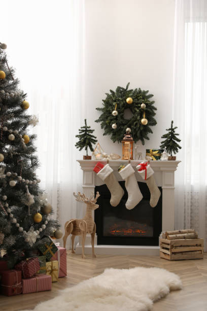 istock Fireplace in room with Christmas decorations. Interior design 1390608625