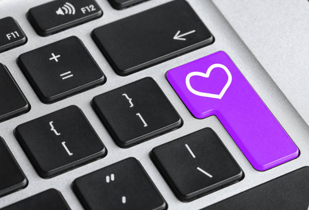 istock Love button on laptop keyboard, closeup. Online dating site 1390609395