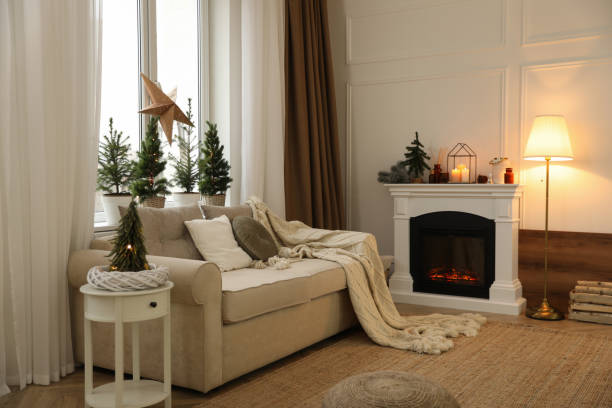istock Fireplace in room with Christmas decorations. Interior design 1390609560