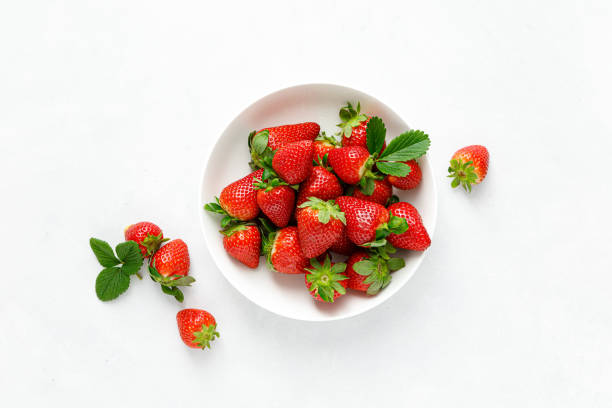 Strawberry on white background, top view, flat lay Strawberry on white background, top view, flat lay strawberry stock pictures, royalty-free photos & images