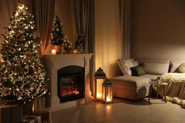 stylish living room interior with beautiful fireplace, christmas tree - window christmas night house imagens e fotografias de stock