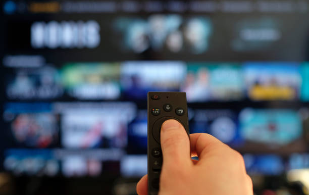binge watching the favorite tv show - changing channels imagens e fotografias de stock