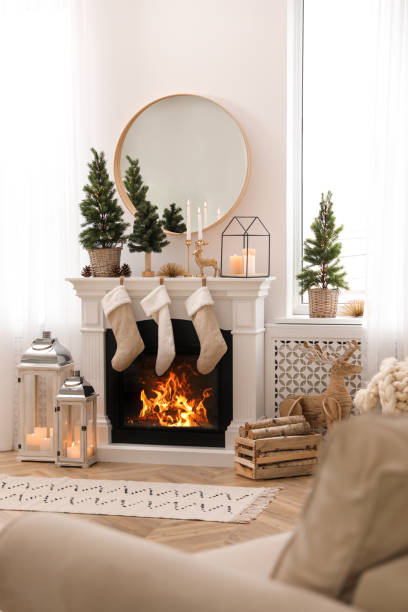 istock Fireplace in room with Christmas decorations. Interior design 1390612211