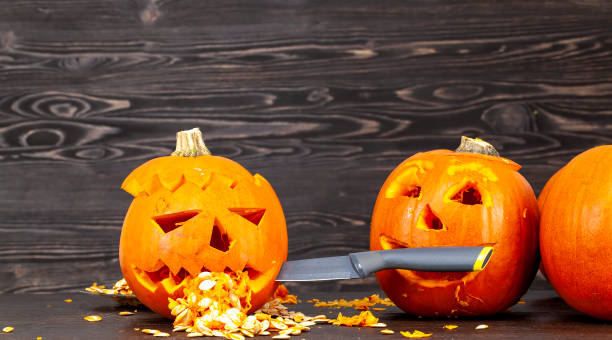 istock preparing an orange pumpkin for Halloween celebration 1390627605