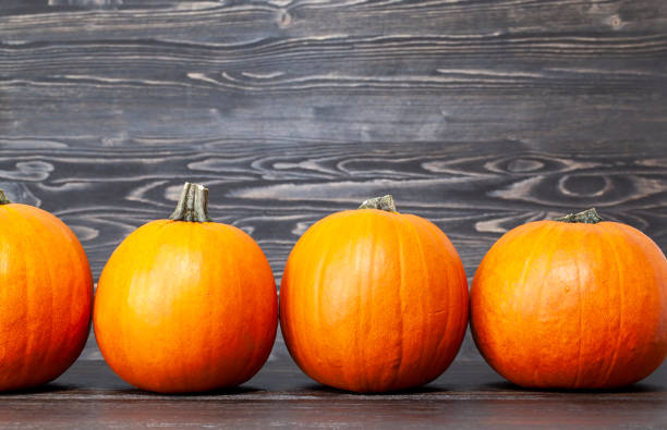 istock preparing an orange pumpkin for Halloween celebration 1390627616