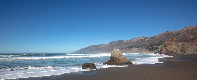 Waves breaking into bay at original Ragged Point at Big Sur on the Central Coast of California United States