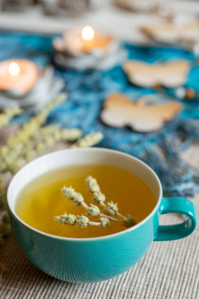 istock Tea in a turquoise cup with decoration - Greek mountain tea, herbal tea, white tea 1390629888