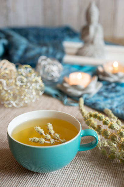 istock Tea in a turquoise cup with decoration - Greek mountain tea, herbal tea, white tea 1390629926