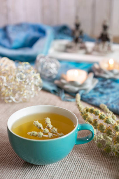 istock Tea in a turquoise cup with decoration - Greek mountain tea, herbal tea, white tea 1390629975