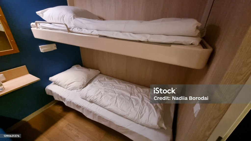 Ship Cabin With Two Bed. Luxury Cabin On Ferry Boat Or Cruise Liner. Cabin on the ferry Apartment Stock Photo