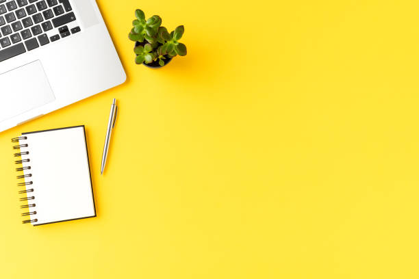 istock Office desktop concept with laptop, notebook and pen. Business background. Top view 1390633155