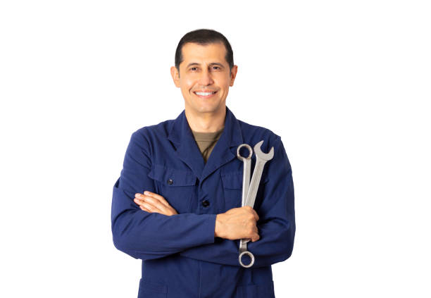 istock smiling mechanic with crossed arms 1390646150