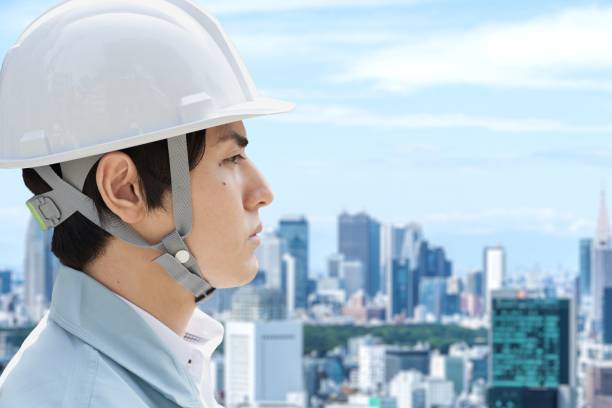 都市を背景にした建設作業員のプロフィール - 作業員 日本人 ストックフォトと画像